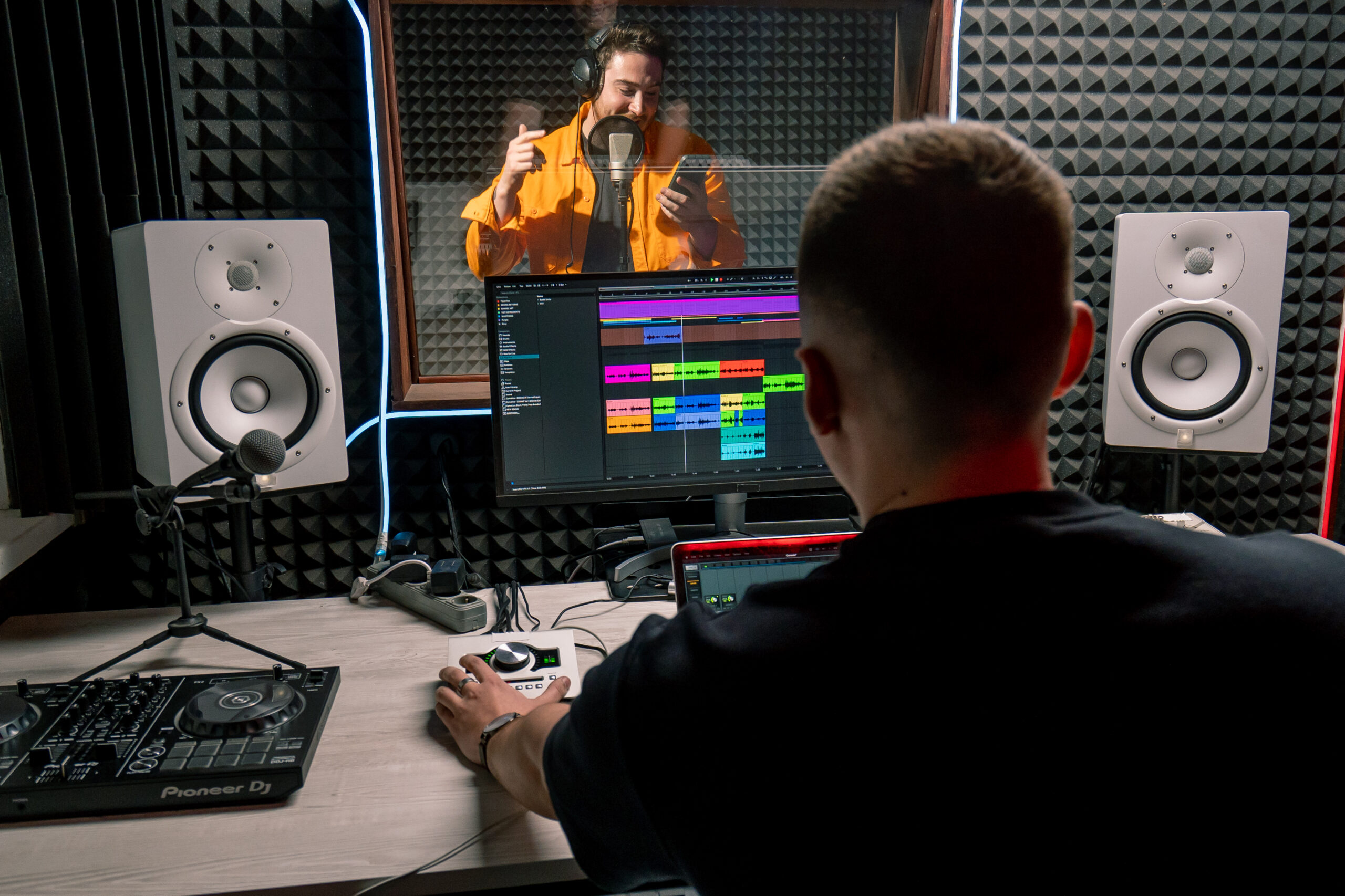 Young artist emotionally recording a new song in a professional recording studio