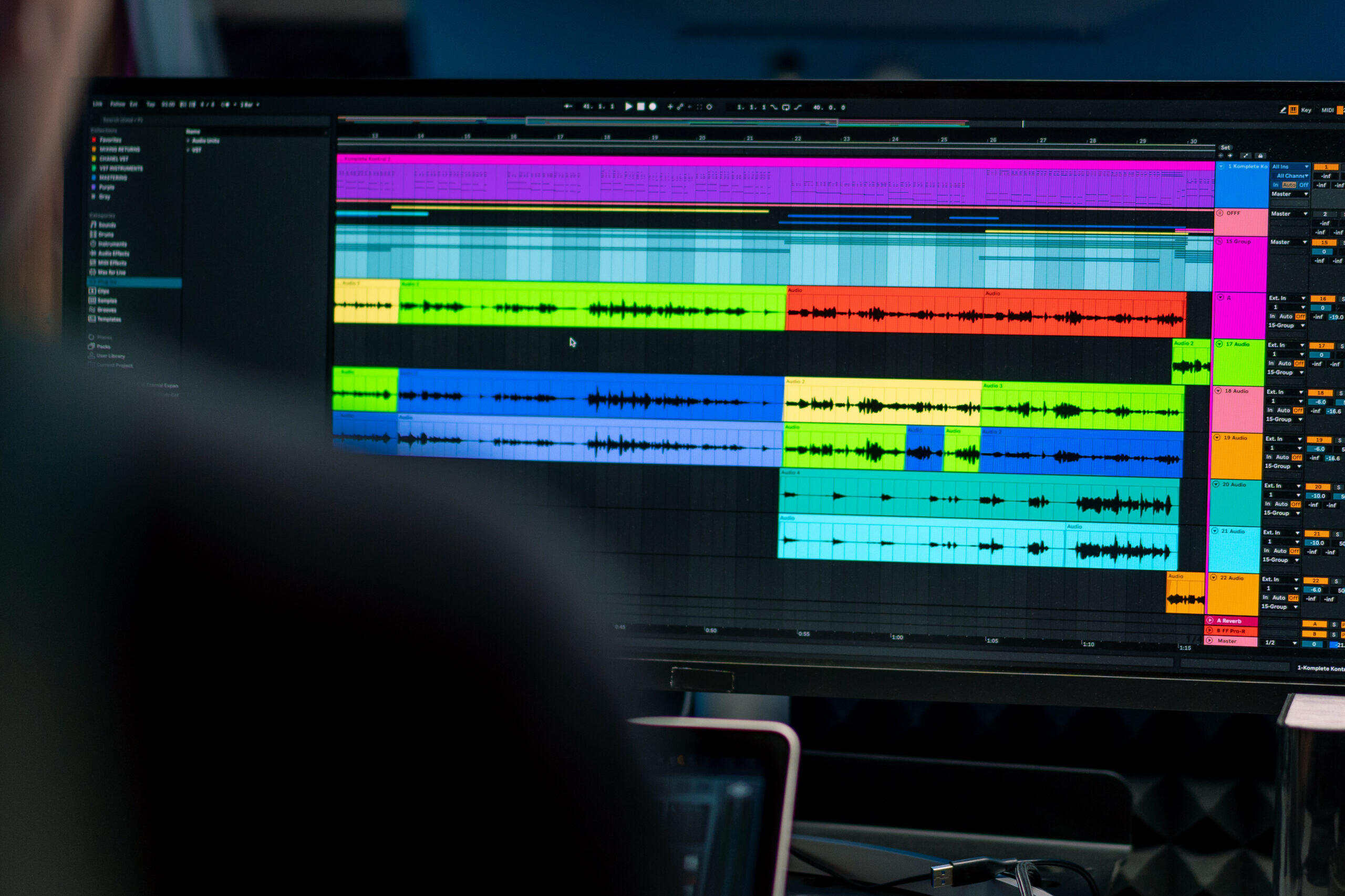 Sound engineer and producer mixing audio tracks in a professional recording studio